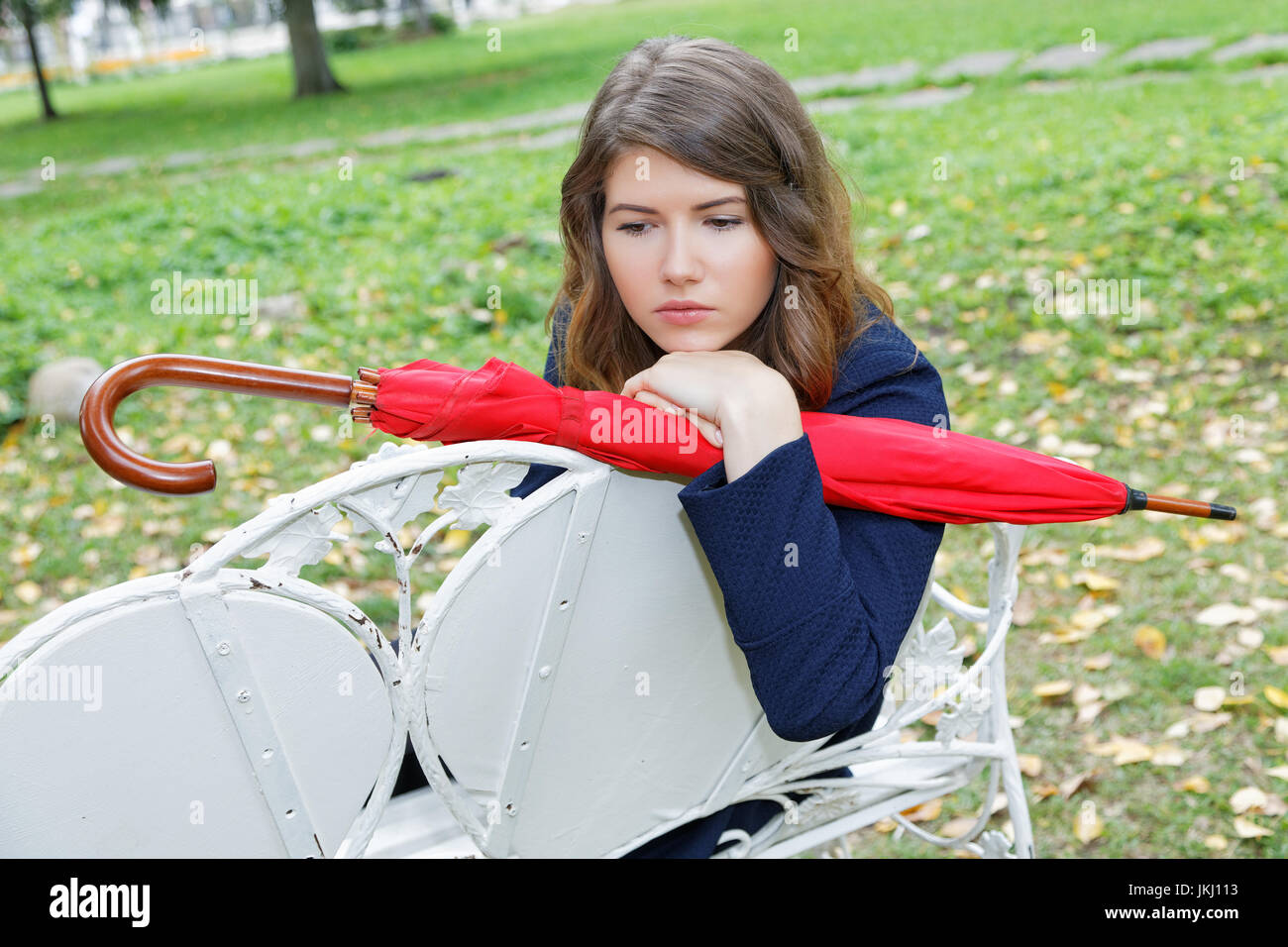 Girl with a red umbrella in the autumn park Stock Photo - Alamy
