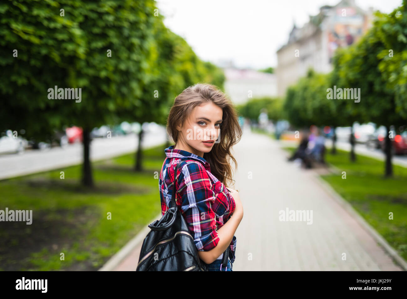 Fashion portrait trendy young woman with backpack in the city Stock ...
