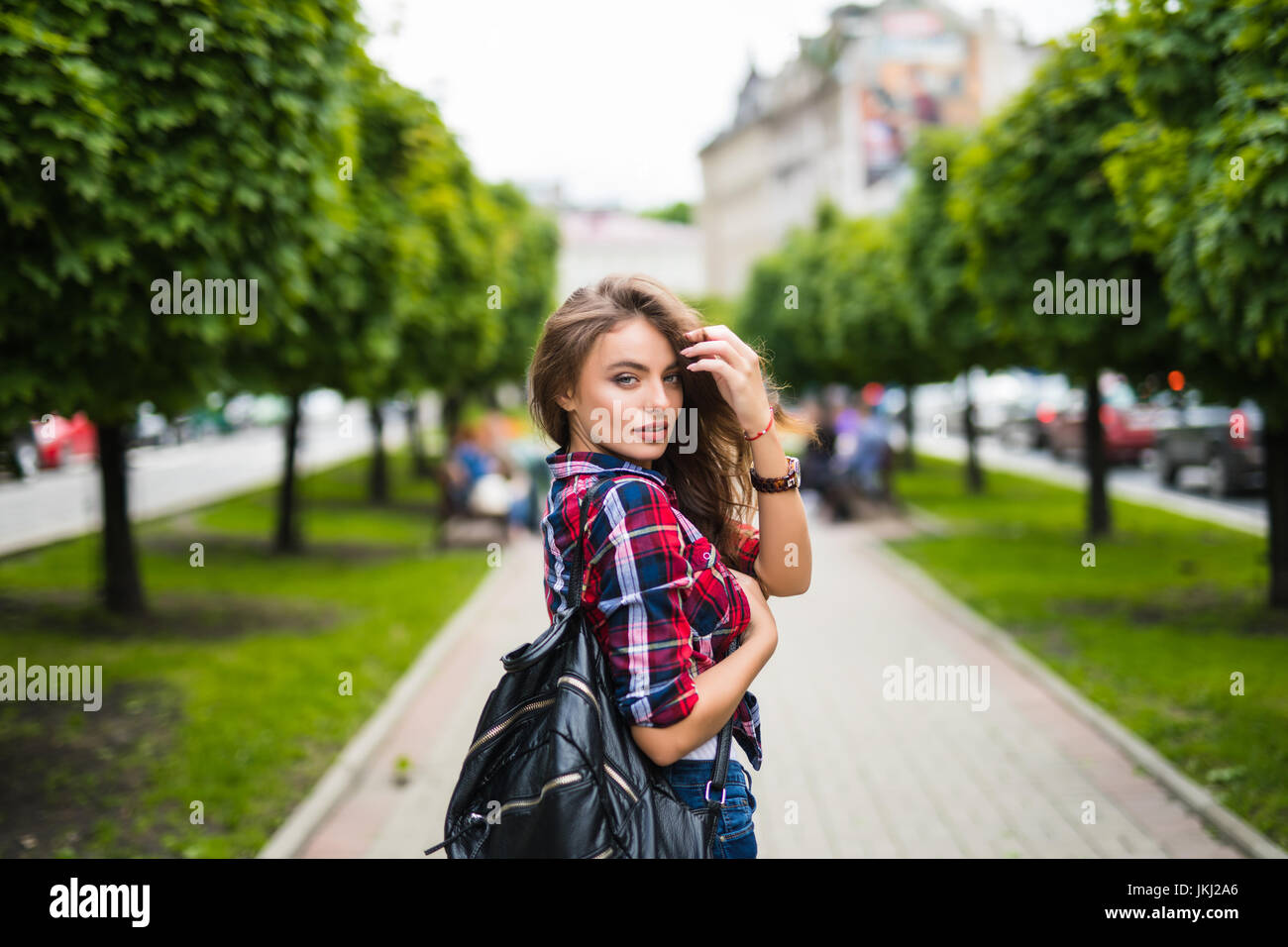 Fashion portrait trendy young woman with backpack in the city Stock ...