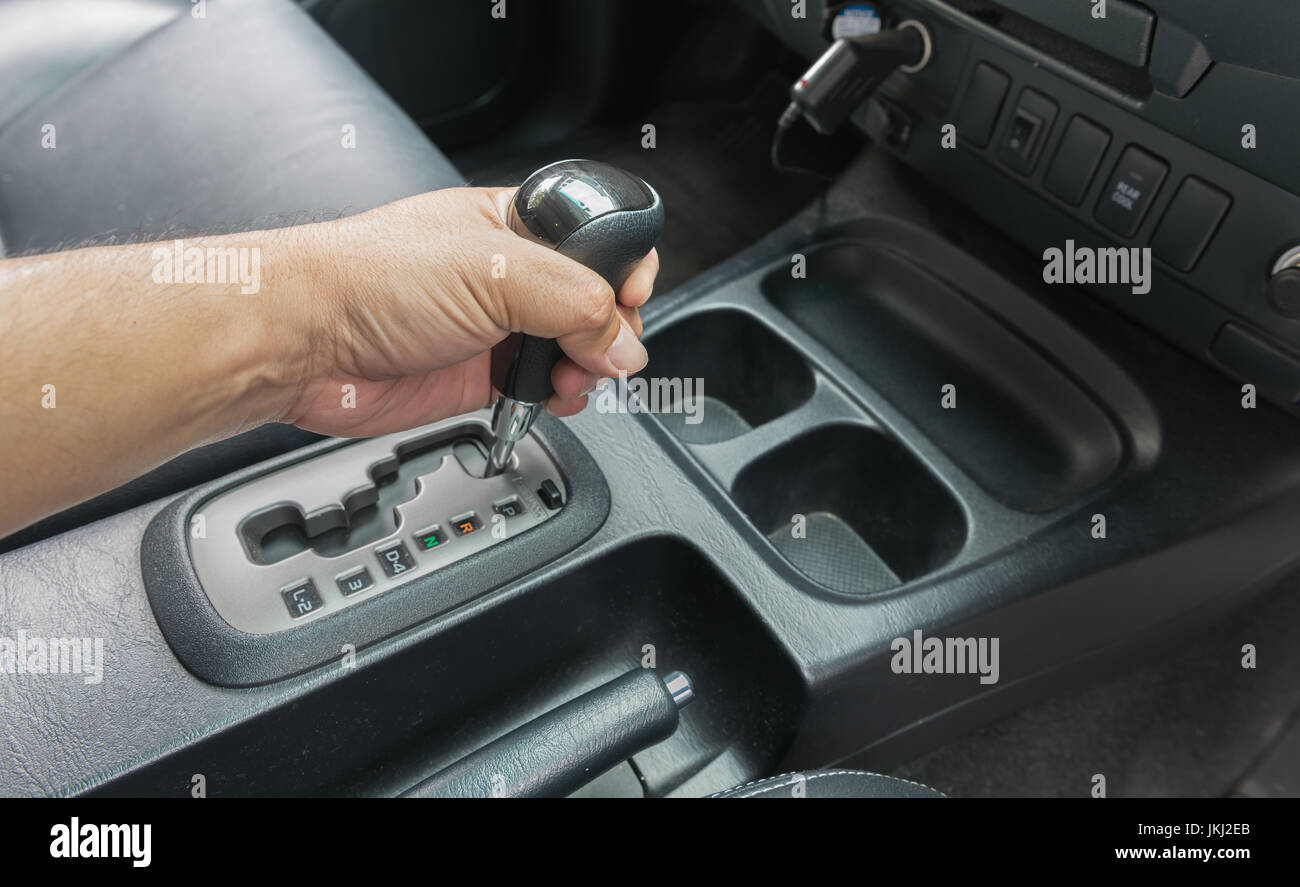 hand on automatic gear Transmission, Man hand shifting an automatic car