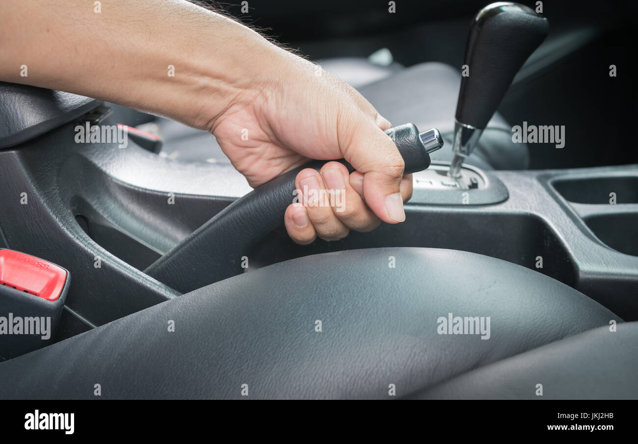 hand man pull hand brake in car Stock Photo Alamy