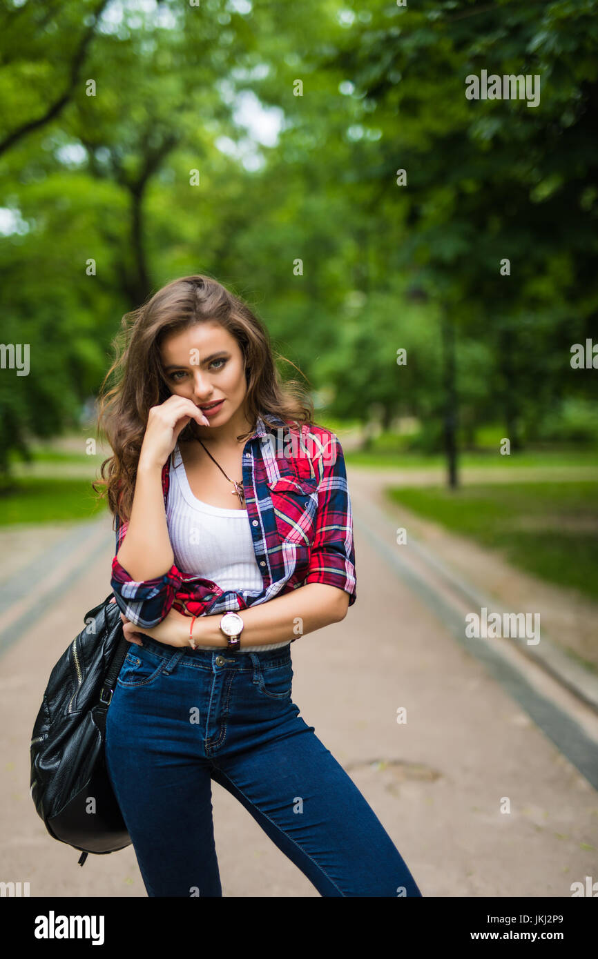 Portrait of urban girl with backpack in the street happy smiling woman ...