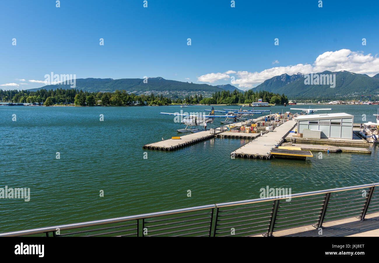 vancouver, Canada - June 21, 2017: Seeplanes and boats at waterfront area as seen near Vancouver Harbour centre and canada place on a sunny summer day Stock Photo