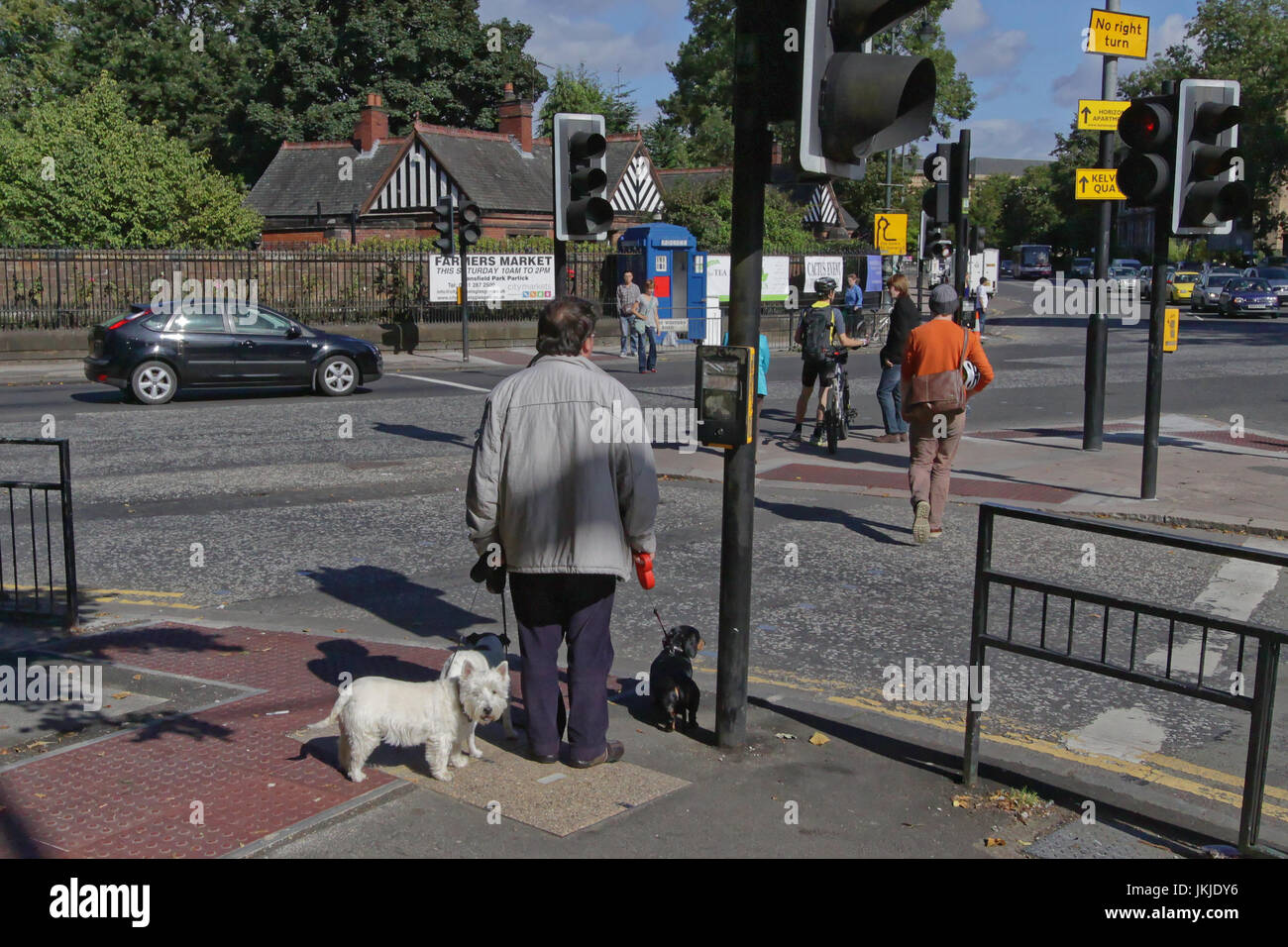 west end of Glasgow scene traffic lights at byres road and great western road at the botanic gardens Stock Photo