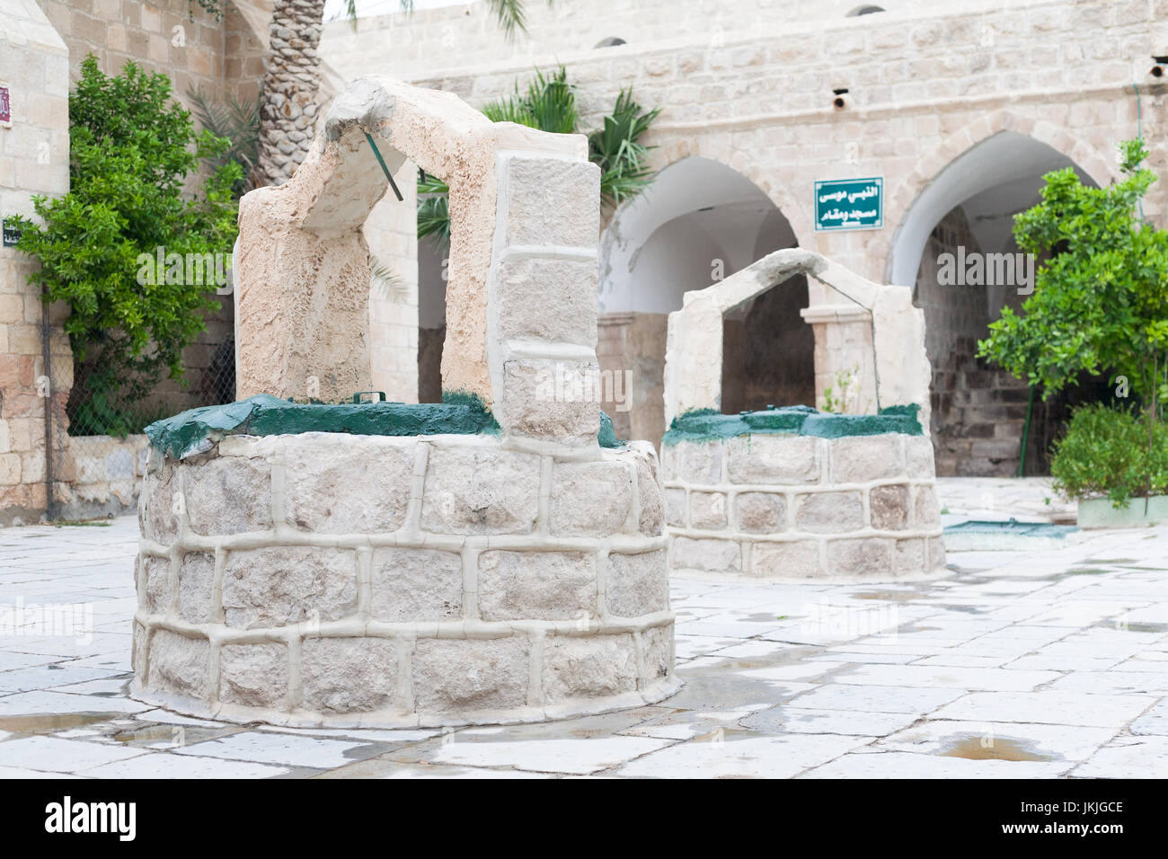 Row of Arabic White Stone Wells in interior mosque courtyard in palestine israel west bank Stock Photo