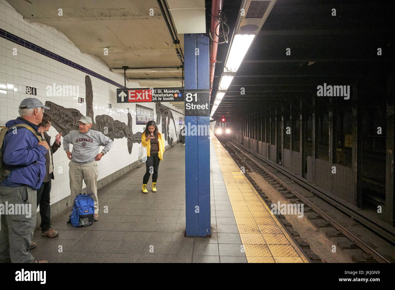 new york subway train approaching platform at 81st street station citybound New York City USA Stock Photo