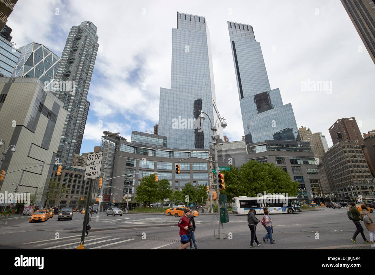 looking along central park south towards columbus circle and the time warner center New York City USA Stock Photo