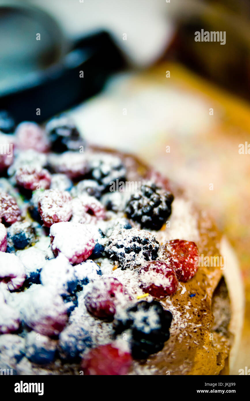 Fresh homemade forest fruits cake with wild fresh blueberries and raspberries. Cake with berries. Stock Photo