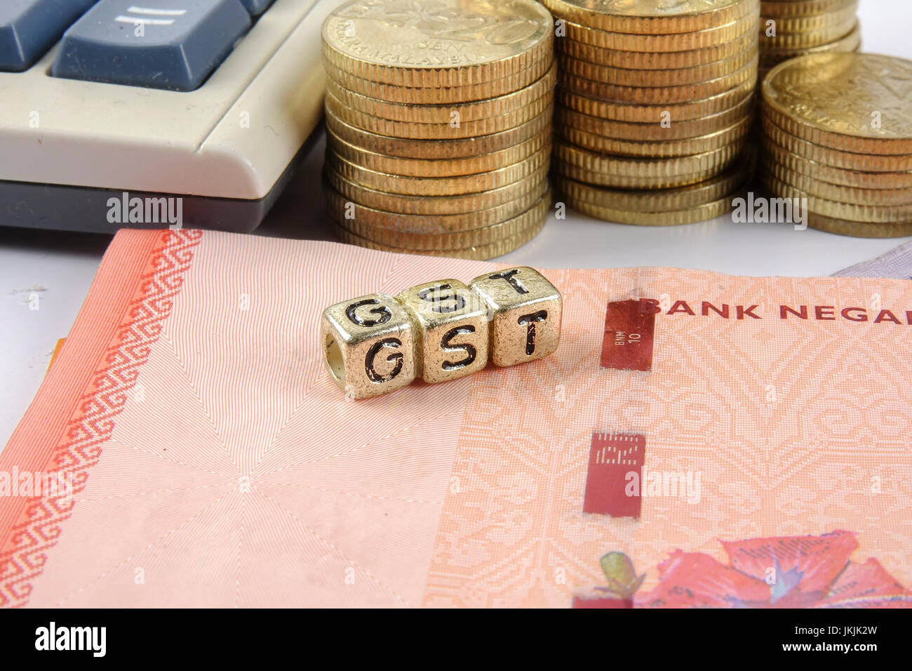 GST wording and gold coins Stock Photo Alamy