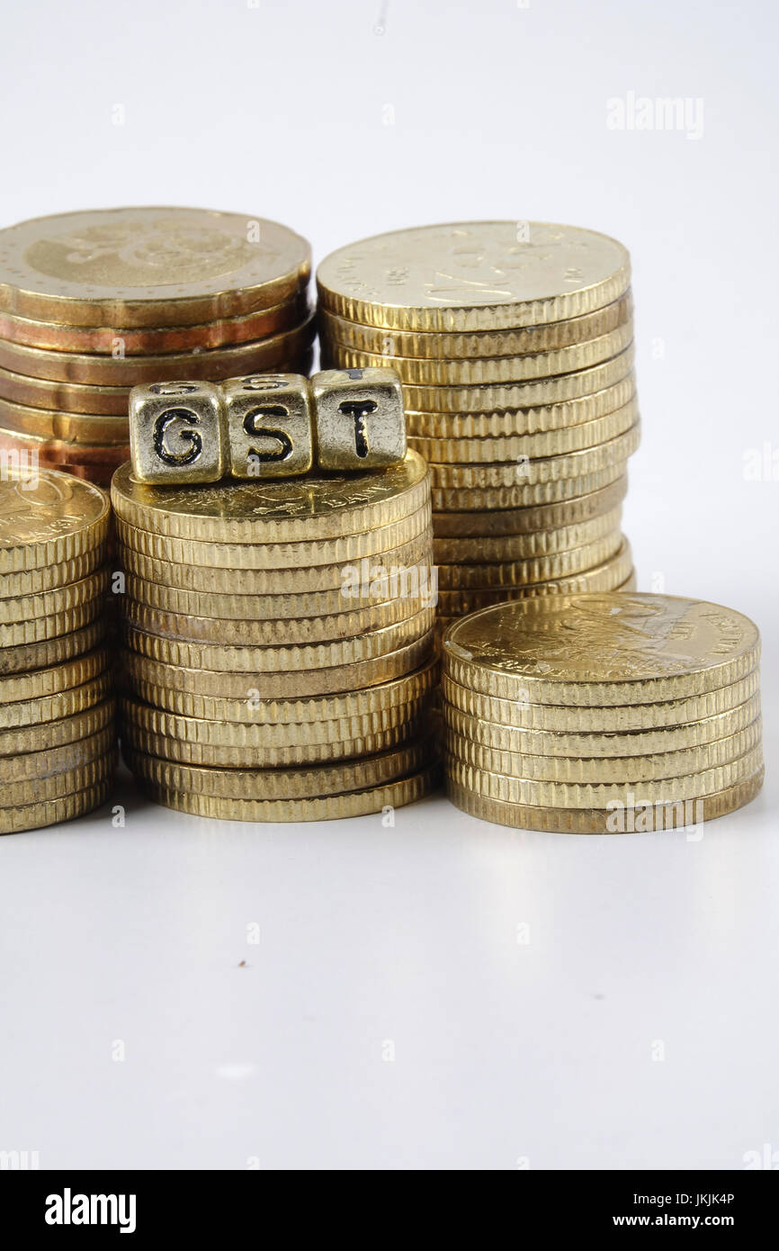 GST wording and gold coins Stock Photo Alamy