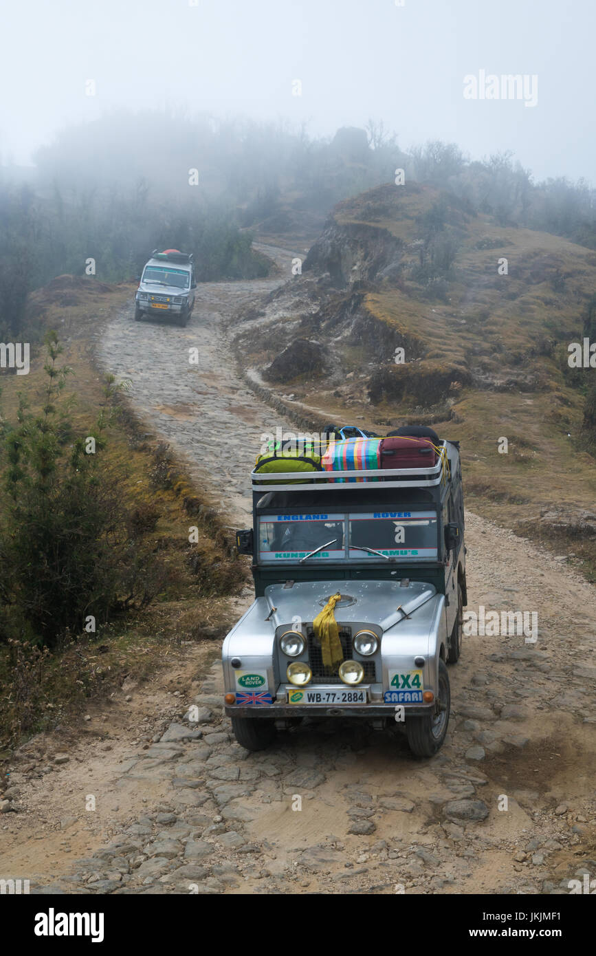 DARJEELING, INDIA - NOVEMBER 28, 2016: Jeep on gravel road through Singalila National Park. It is the route to Sankakphu and Phalut, the two highest p Stock Photo