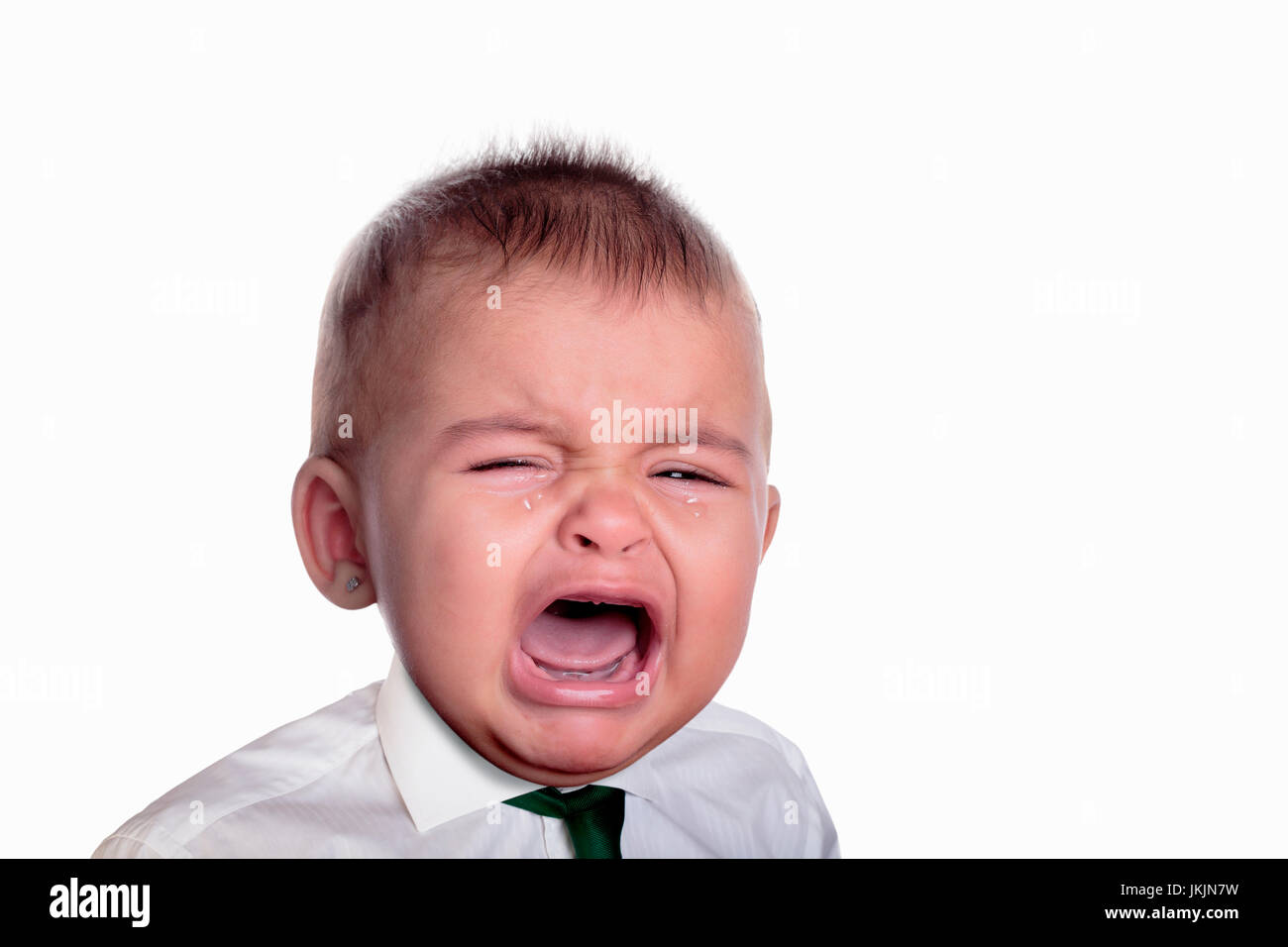 Portrait of a young executive child crying on white background Stock ...