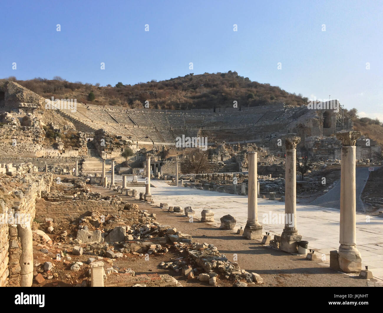 Roman amphitheater ruins end to the main road with stone columns row in ephesus Archaeological site in turkey Stock Photo
