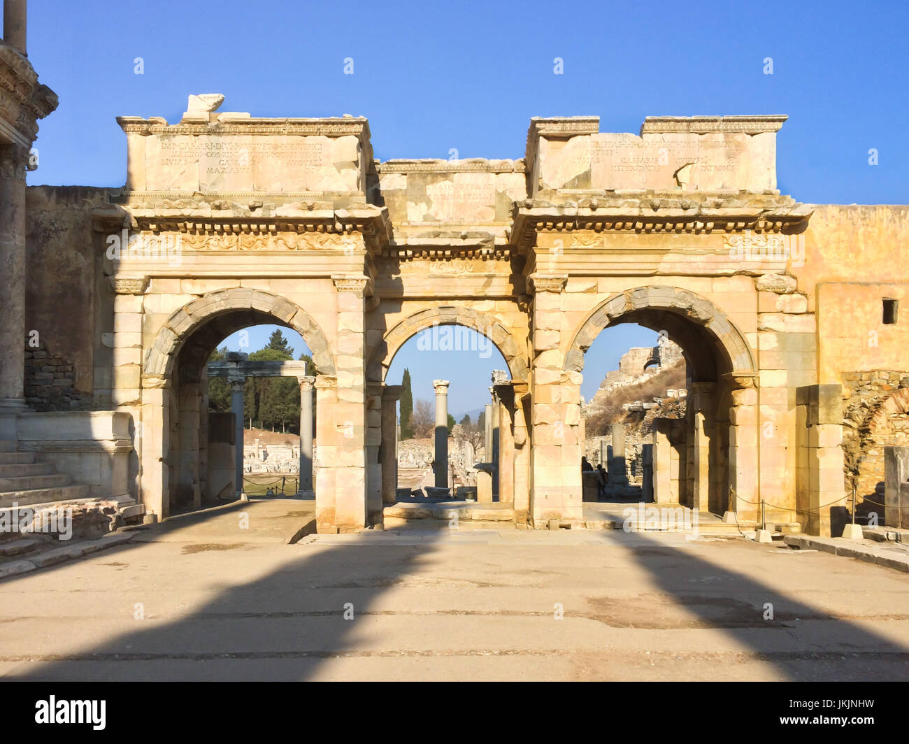 Roman gate arc ruins with stone columns row in ephesus Archaeological site in turkey Stock Photo