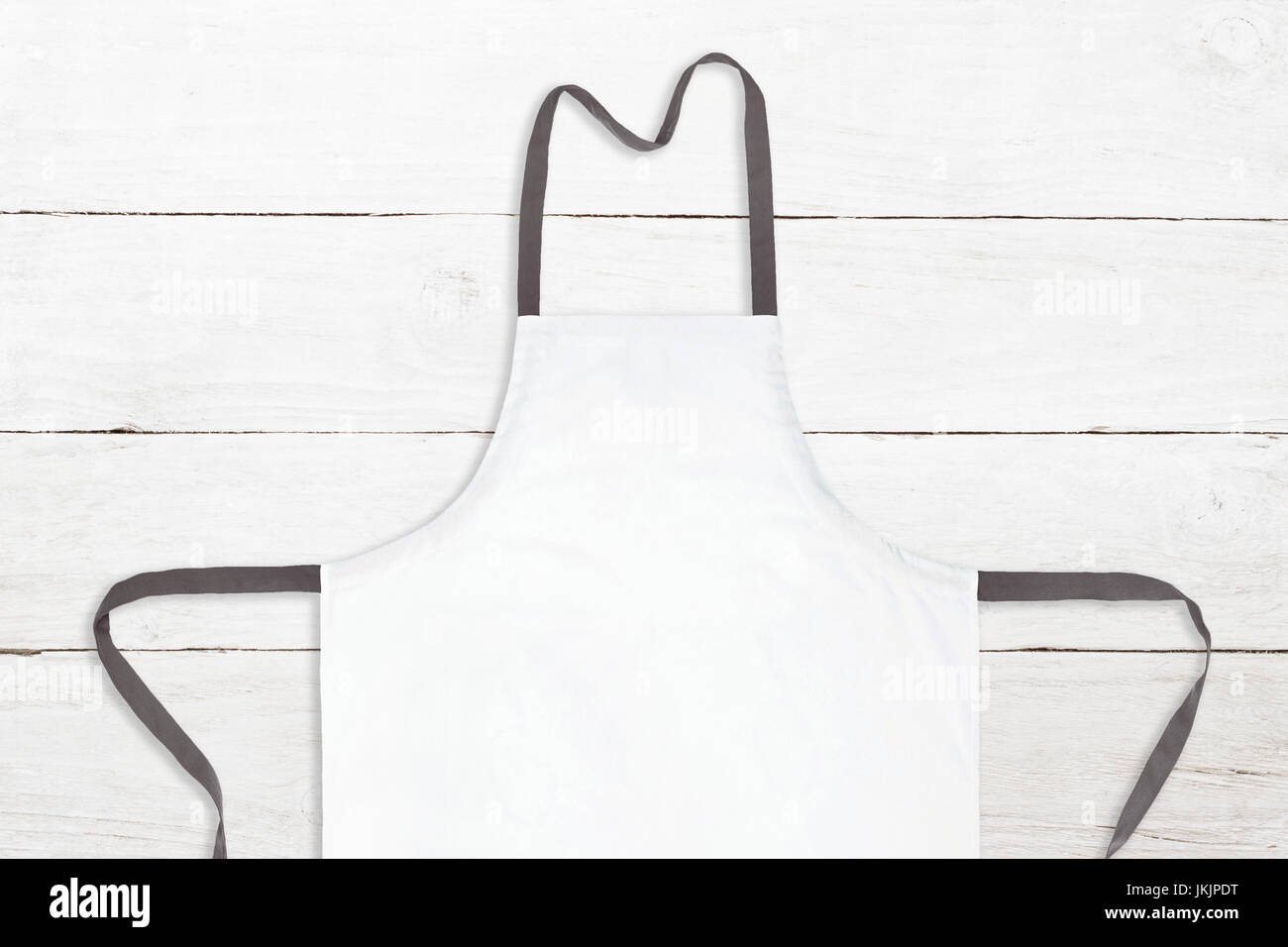 White apron on white wooden texture Stock Photo - Alamy
