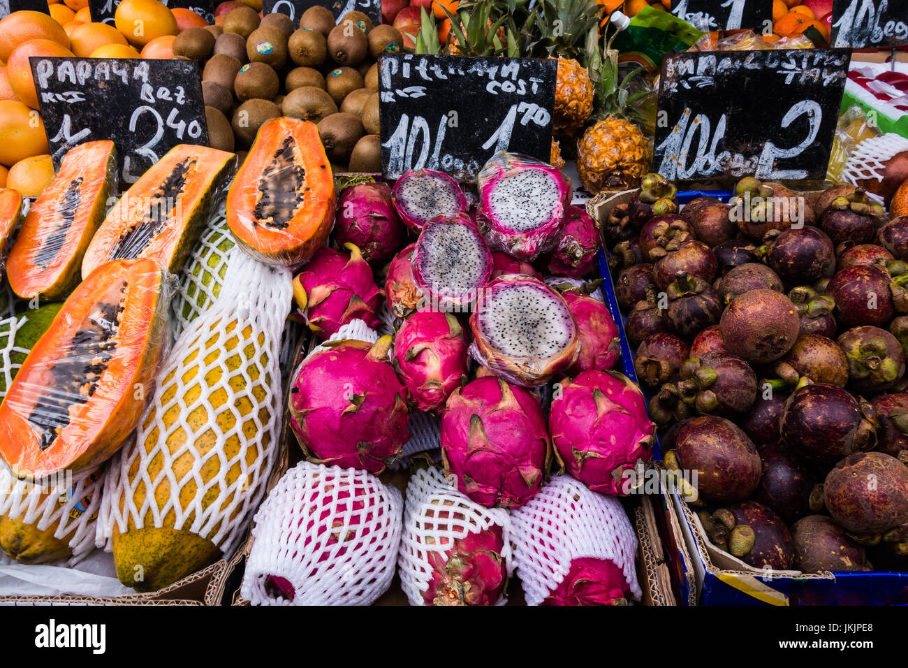 A variety of fresh and exotic fruit and vegetables in display for sale in a street market Stock
