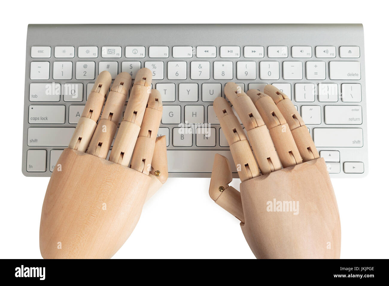 Computer keyboard with wooden dummy hands typing Stock Photo Alamy