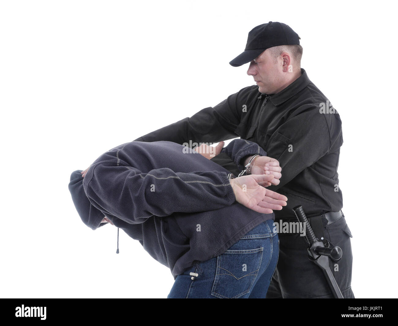 Handcuffed man being escorted by the policeman Stock Photo