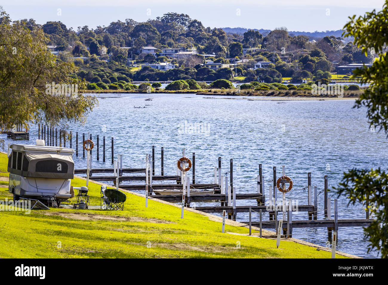 Typical Australian vacation caravan camping and barbeque on grass
