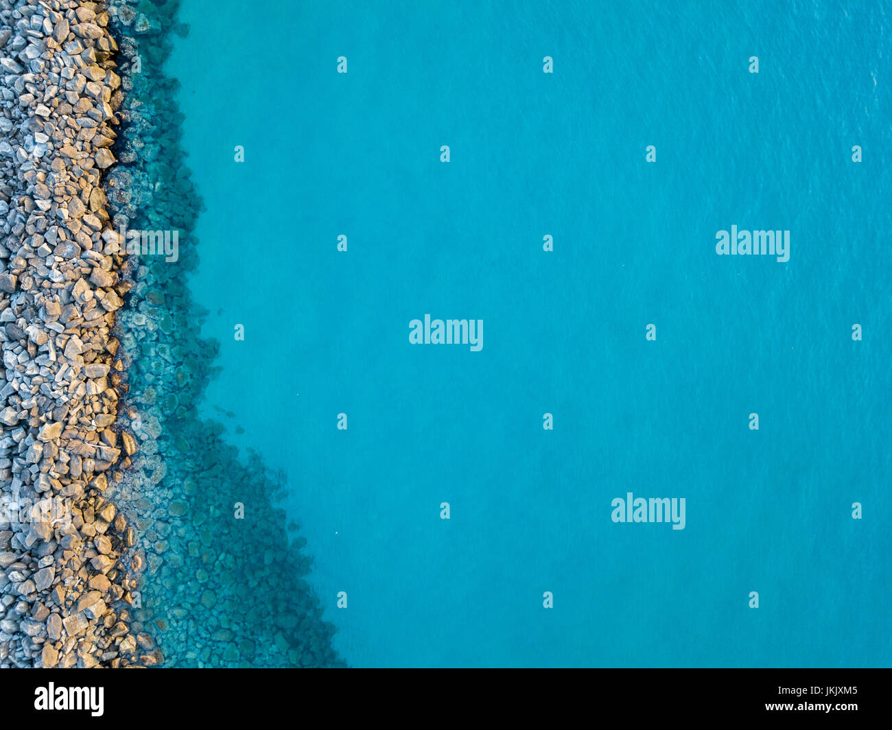 Aerial view of rocks on the sea. Overview of the seabed seen from above, transparent water Stock Photo