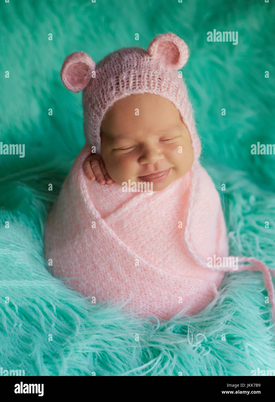Portrait of a newborn baby wrapped in a cocoon on a fur Stock Photo Alamy