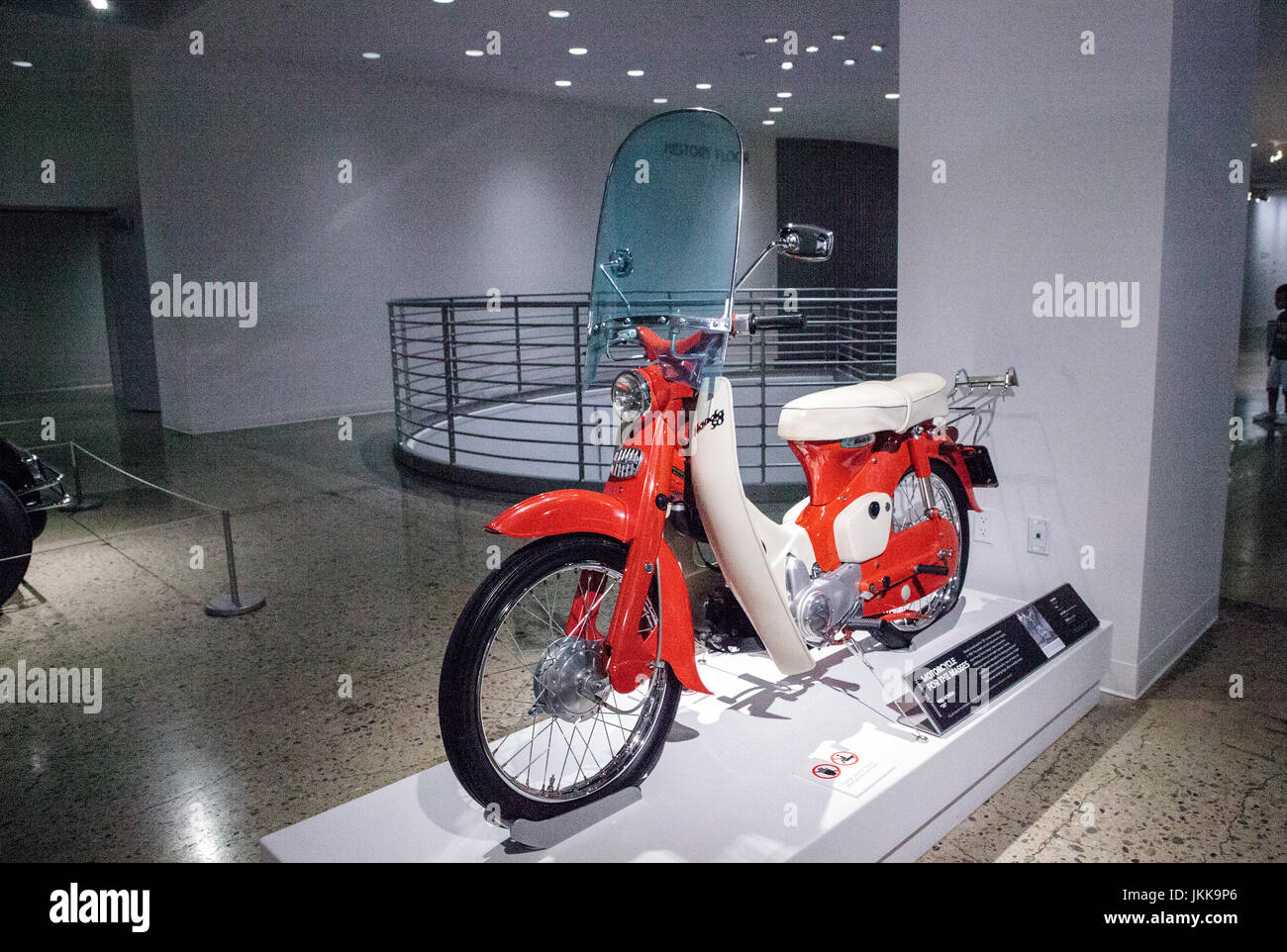 Los Angeles, CA, USA - July 23, 2017: Orange 1961 Honda 50 motorcycle displayed at the Petersen Automotive Museum. Editorial use. Stock Photo