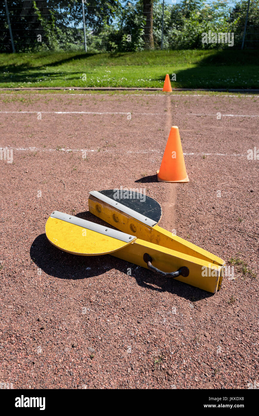 starting clapper at start point of cinder track Stock Photo Alamy