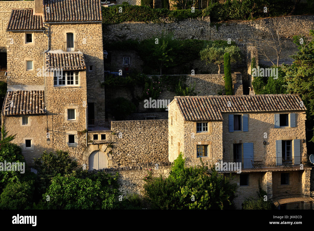 Cute houses with blue shutters in Gordes, Provence, France Stock Photo