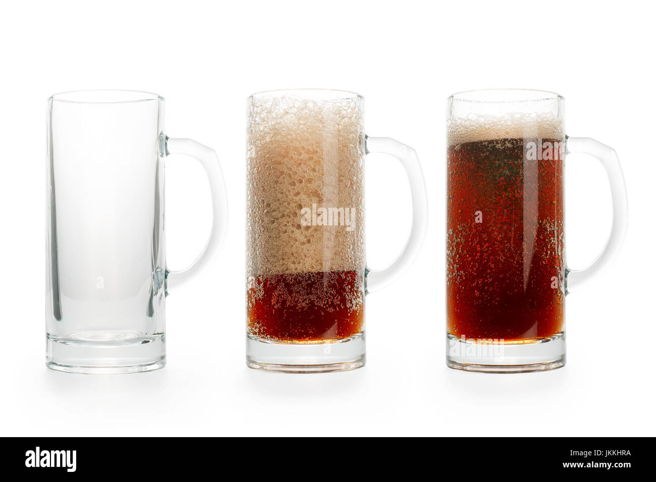 Three pints of dark beer. Empty, half full and full. Isolated on white, clipping path included Stock Photo