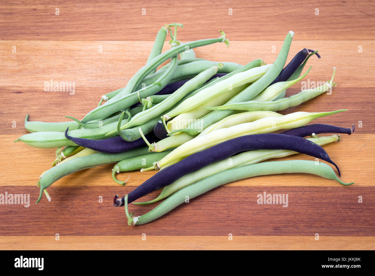 bunch of harvested bean Purple, green and yellow Wax Snap Beans Stock Photo