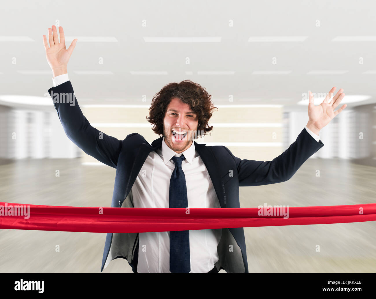 Successful businessman on the finishing line Stock Photo