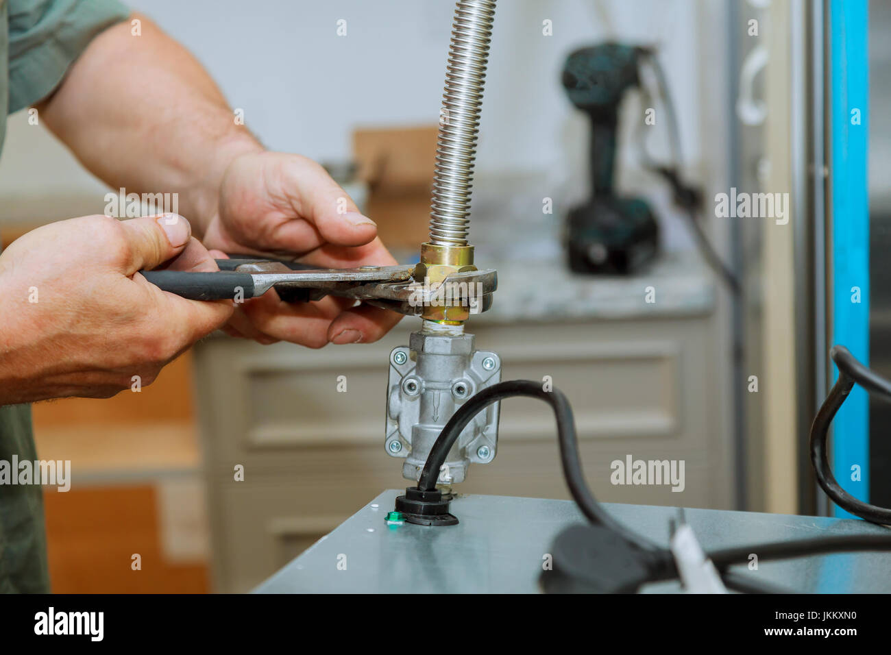 Gas hob and oven in a kitchen The master installs a gas oven in a new