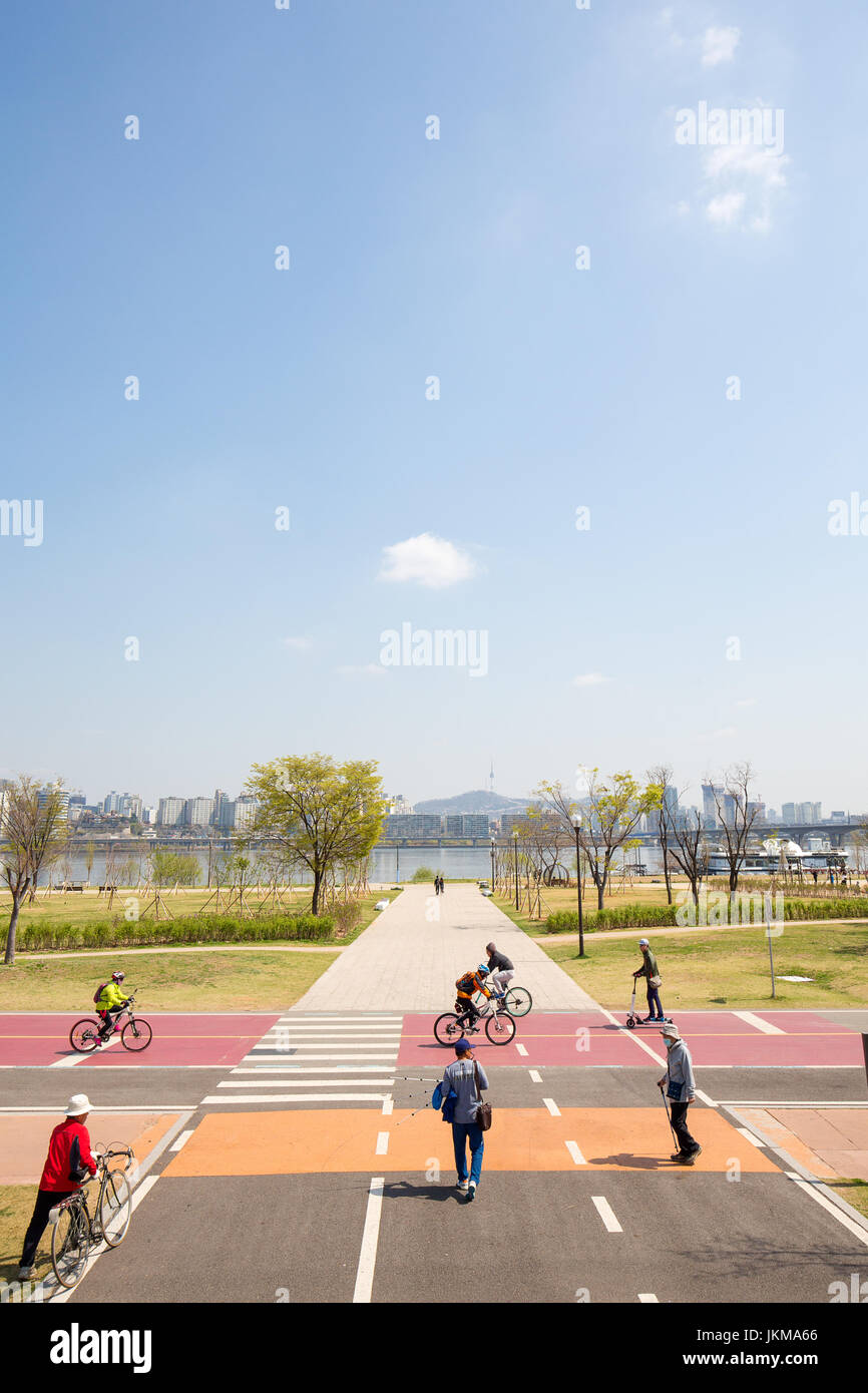 People exercise in the  Yeouido Hangang  park. Stock Photo