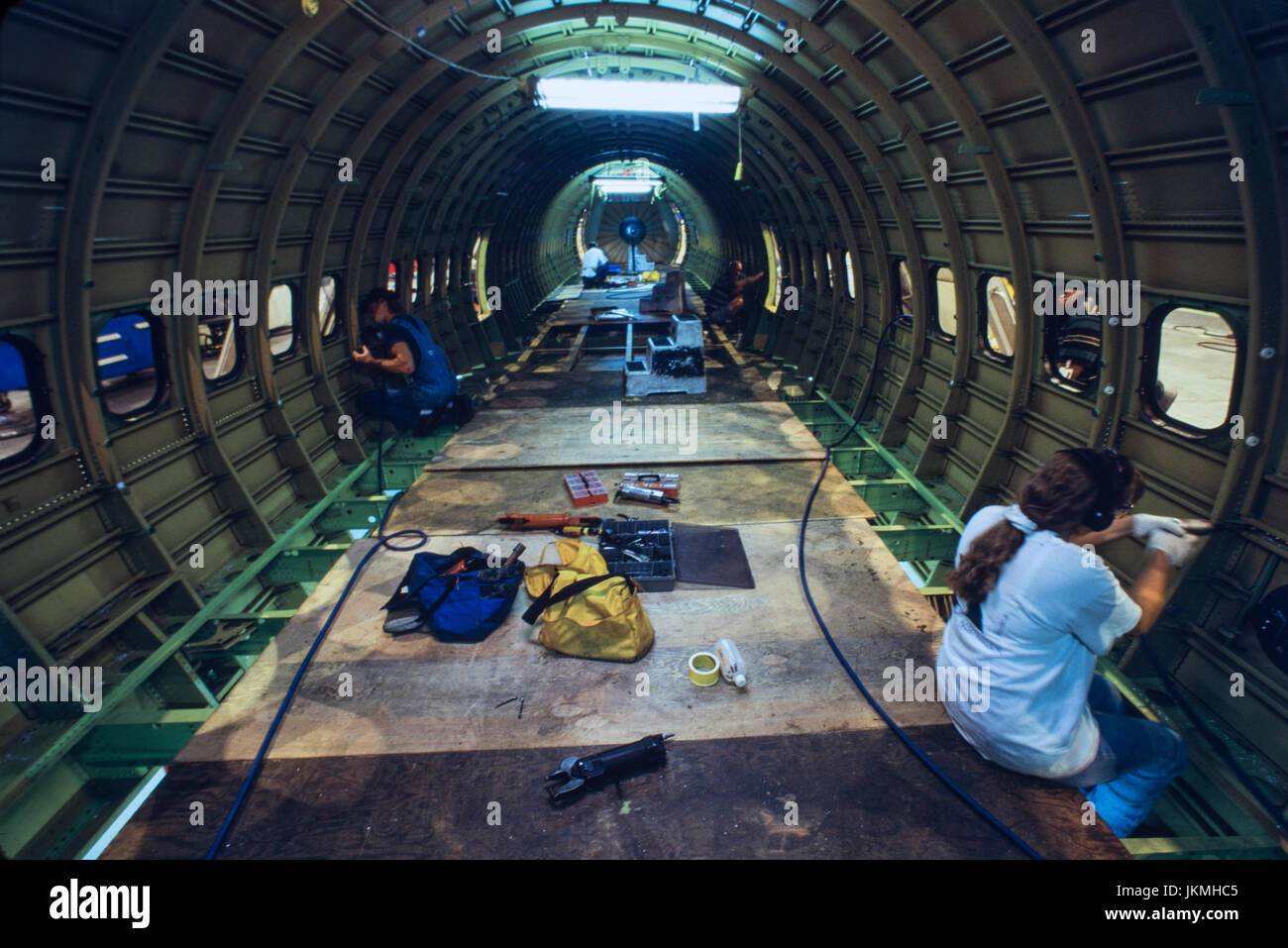 Skilled aerospace workers build a commercial Boeing 737 aircraft Stock