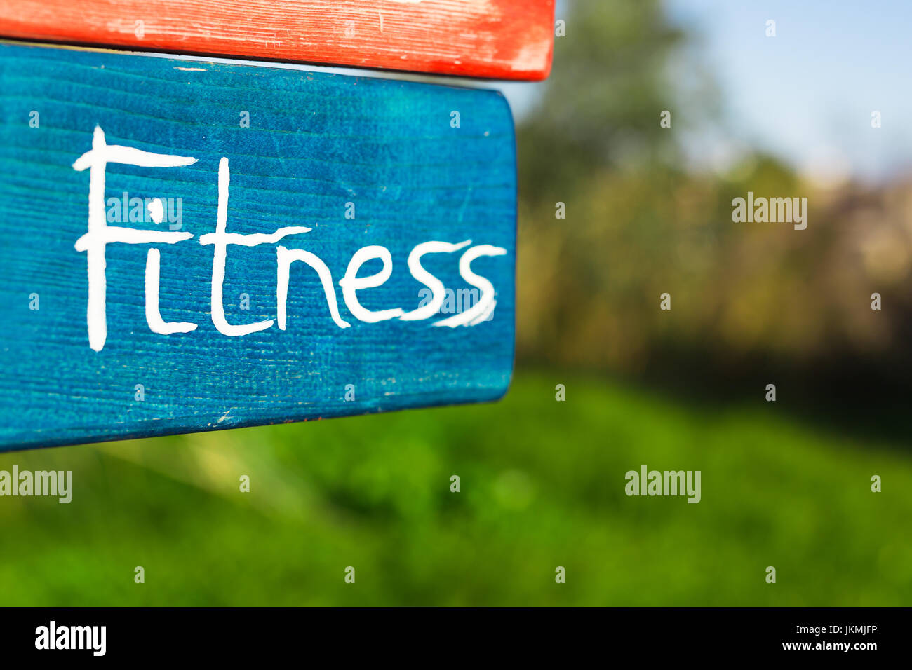 Wooden Sign Fitness on Natural green background Stock Photo - Alamy