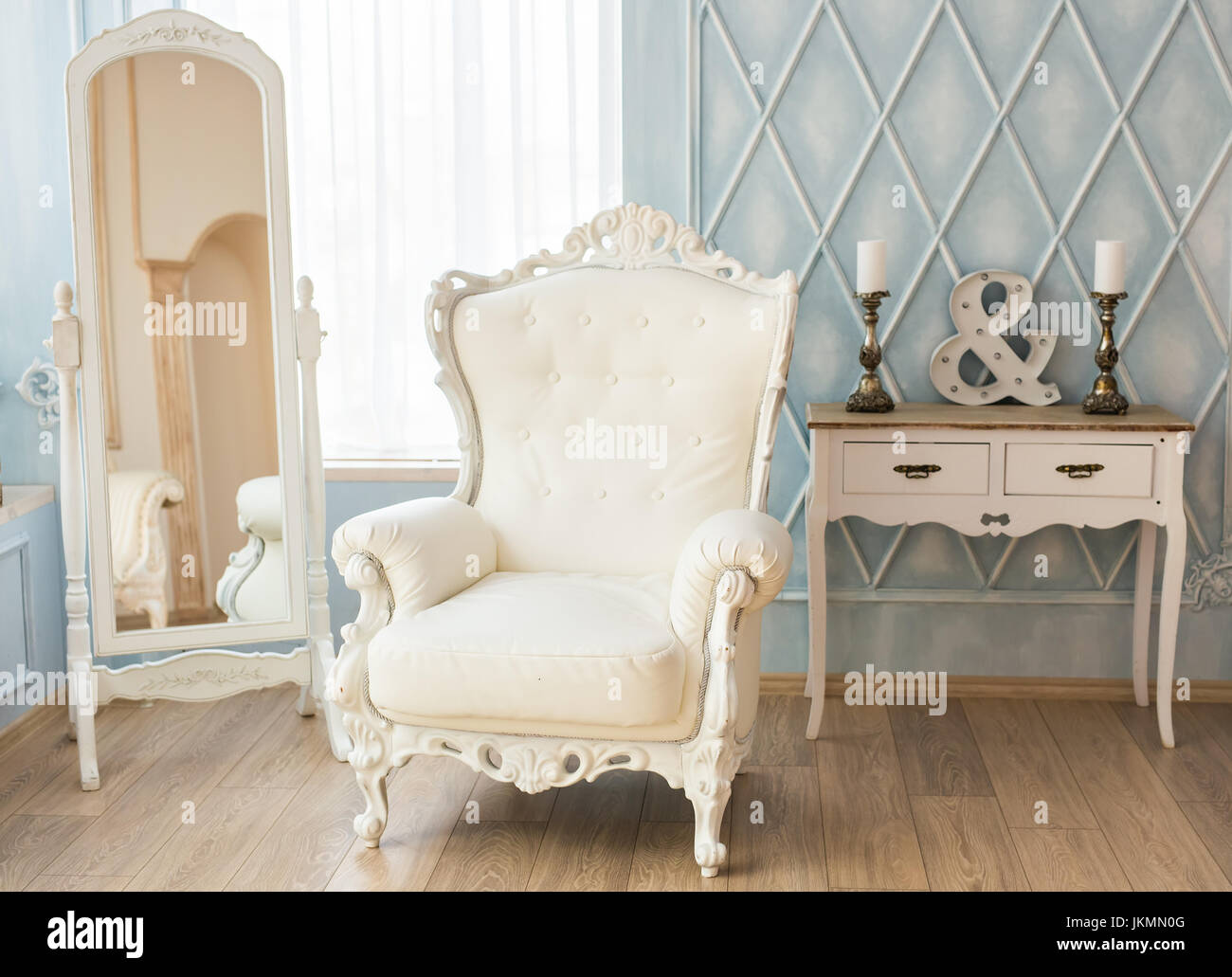 luxury armchair in a plain white interior Stock Photo - Alamy