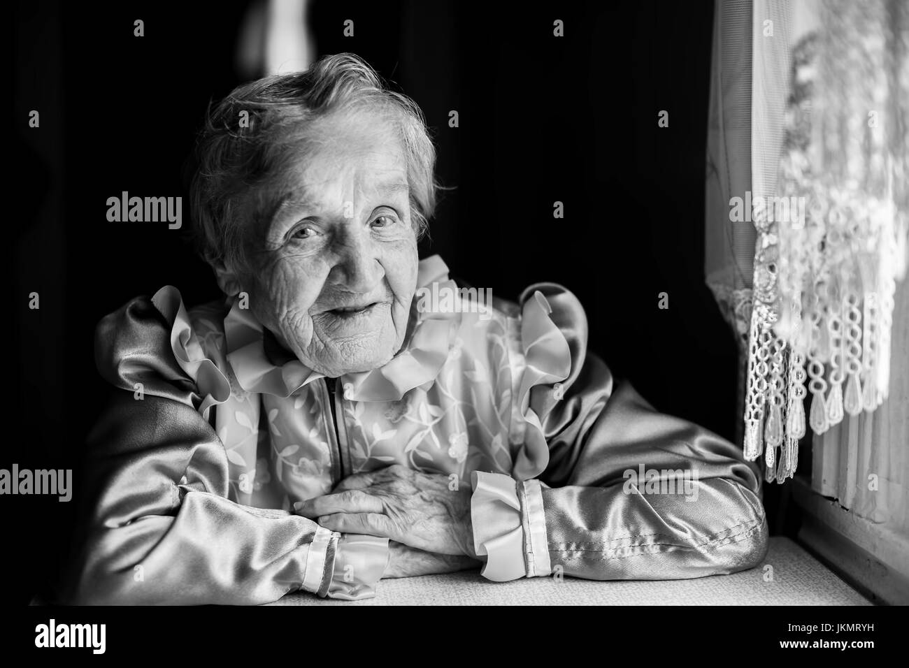 Portrait of elderly woman, black-and-white photography. Stock Photo