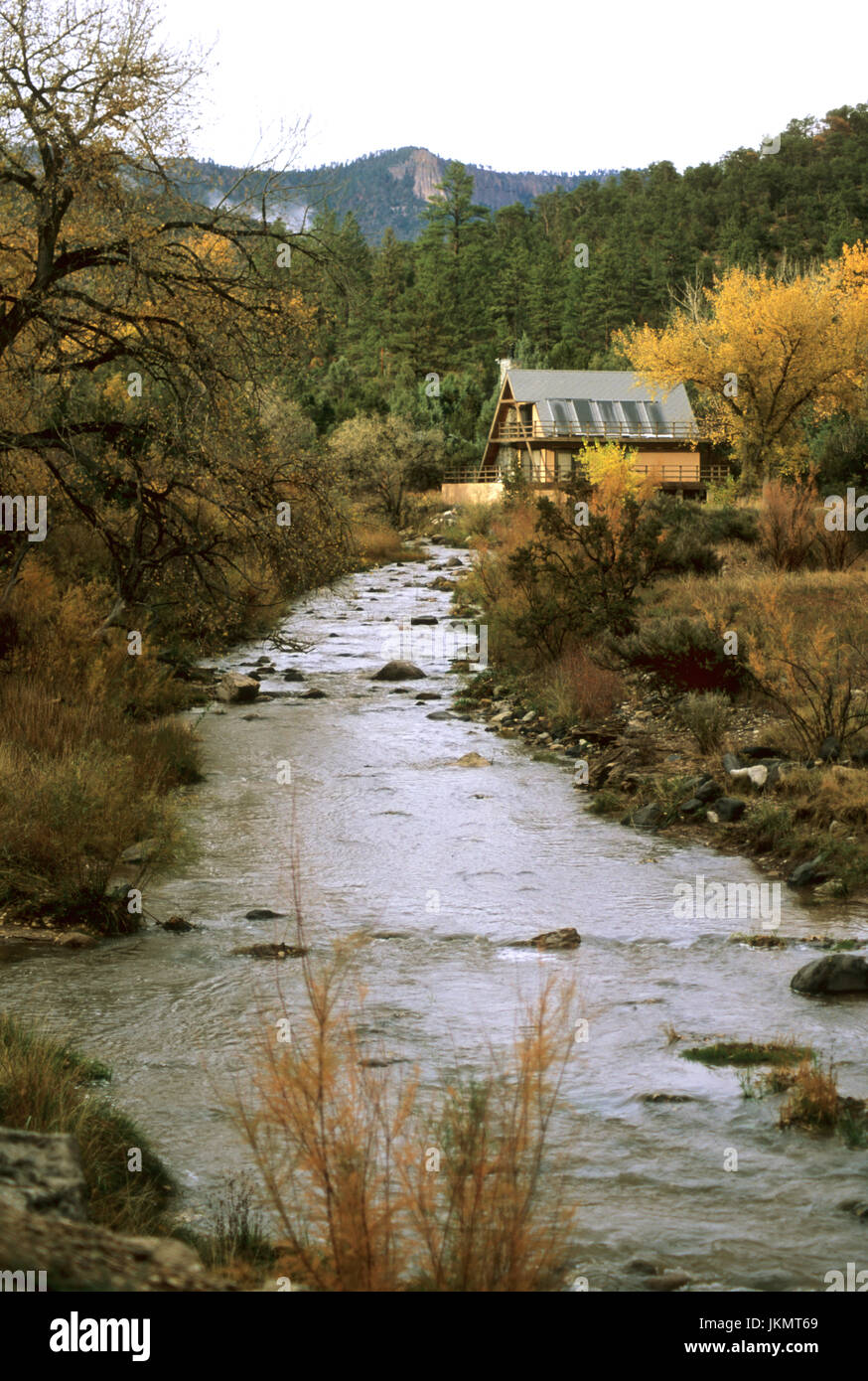 House near stream in New Mexico Stock Photo