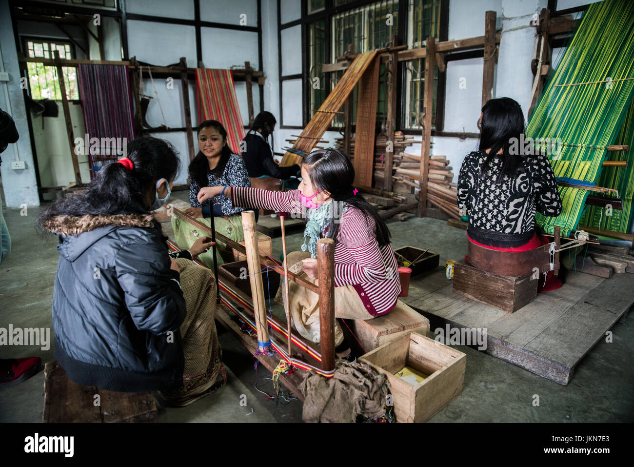 GANGTOK, INDIA - DECEMBER 3, 2016: Trainee undergoing training in weave yarn at the  Directorate of Handicrafts & Handlooms in Gangtok. Stock Photo