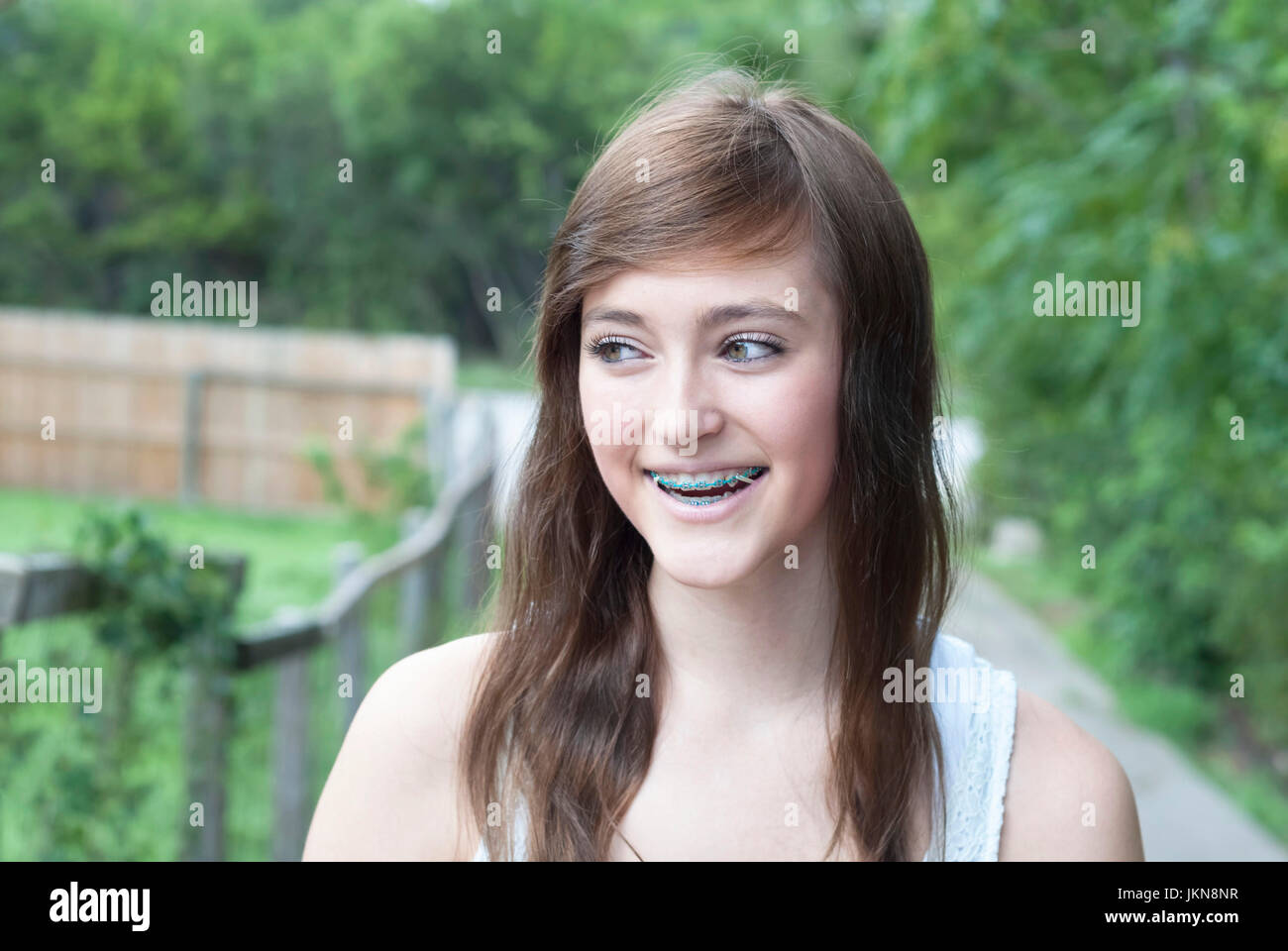 Pretty teenaged girl with braces laughing Stock Photo Alamy