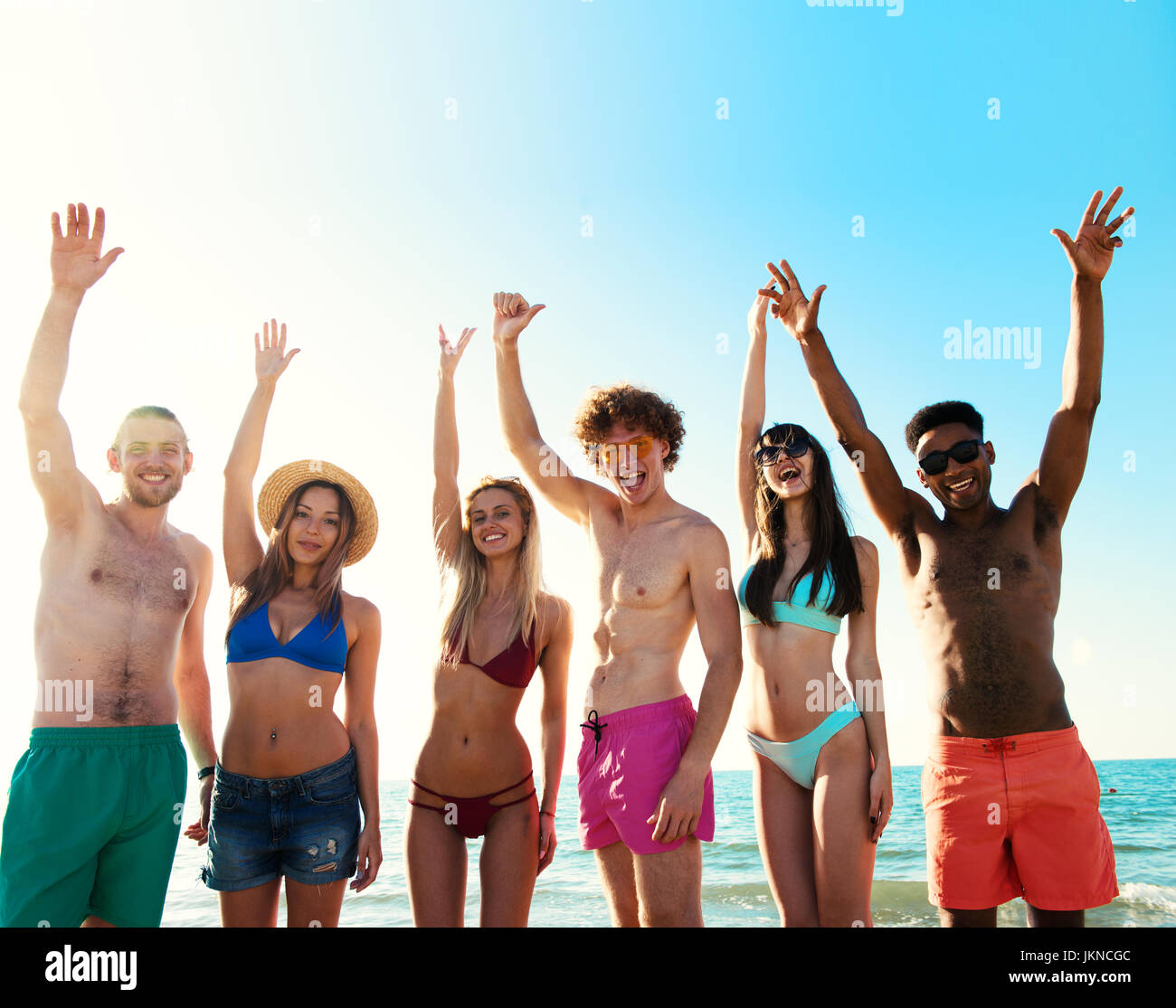 Group of friends having fun on the beach Stock Photo