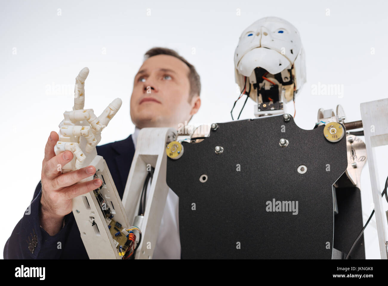 Excited brilliant scientist presenting his invention Stock Photo - Alamy