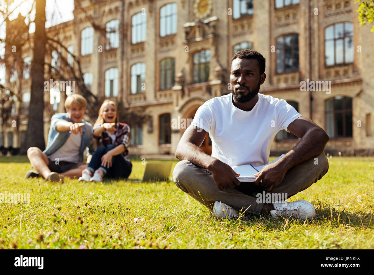 Young African American feeling like an outsider Stock Photo