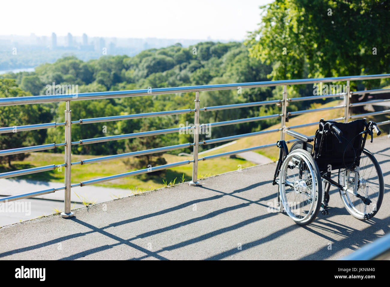 New lonely wheelchair standing on a terrace Stock Photo