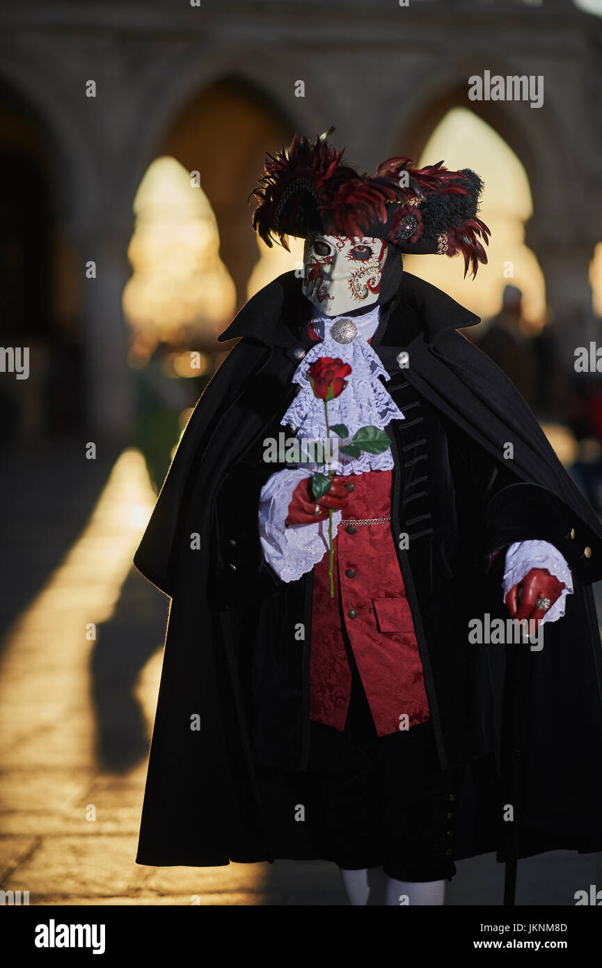 Bauta Mask and hat with red feathersin Carnival of Venice Stock Photo