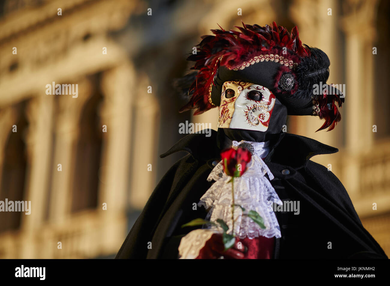 Bauta Mask and hat with red feathersin Carnival of Venice Stock Photo