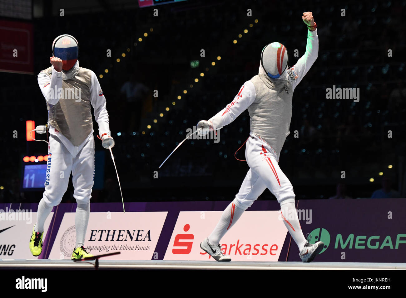 Toshiya Saito of Japan, right, reacts during the men's foil Final match