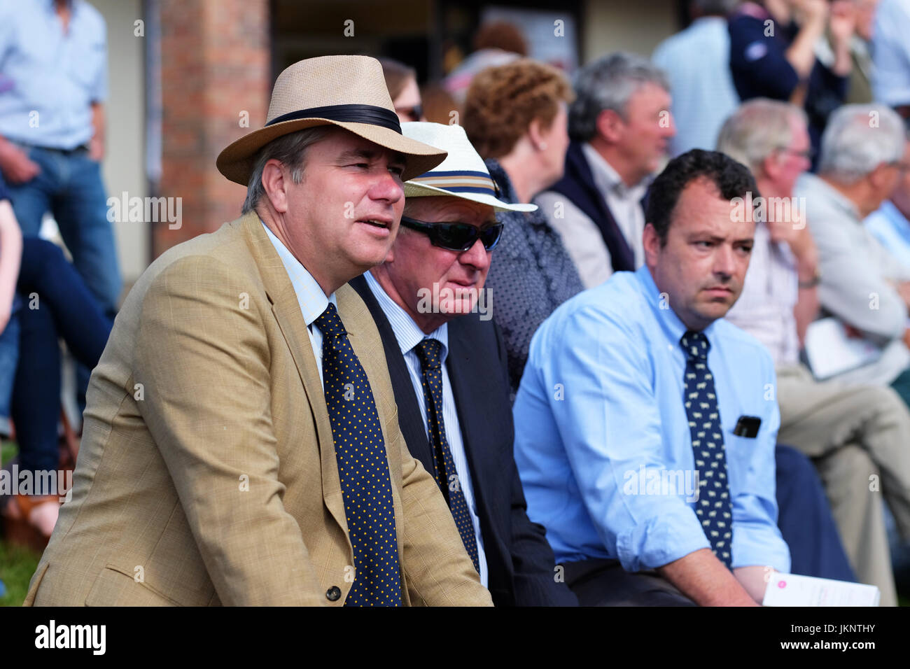 Builth Wells, Wales, UK. 24th July, 2017. Royal Welsh Show: Opening Day of the largest four day agricultural show in Wales. Dapper fashion among the early spectators watching the cattle judging. Photo Steven May / Alamy Live News Stock Photo