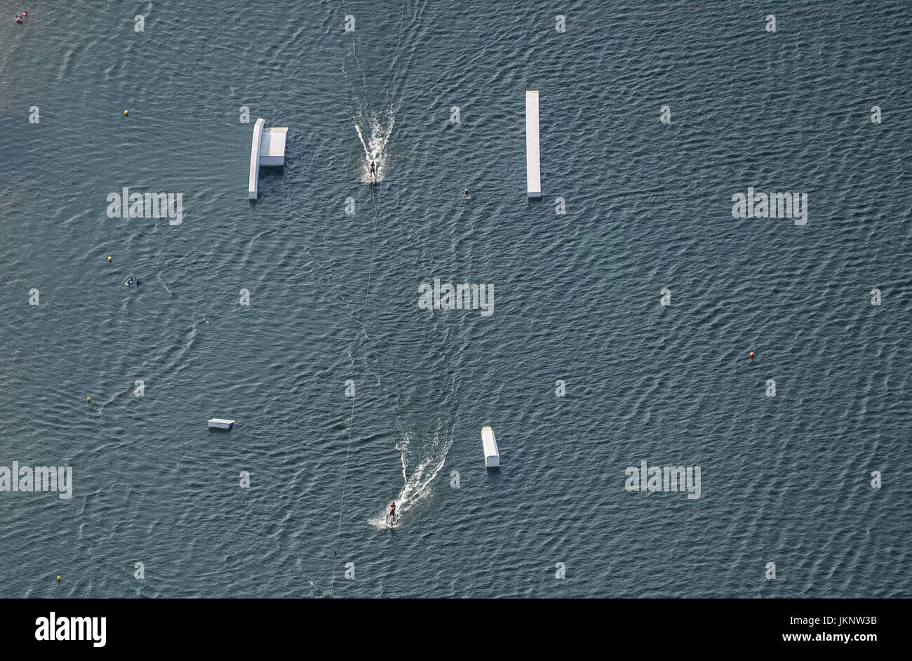 Salzgitter-Lebenstedt, Germany. 19th July, 2017. People wakeboard on the Salzgitter Lake near Salzgitter-Lebenstedt, Germany, 19 July 2017. (Aerial View taken with an ultralight aircraft) Photo: Silas Stein/dpa/Alamy Live News Stock Photo