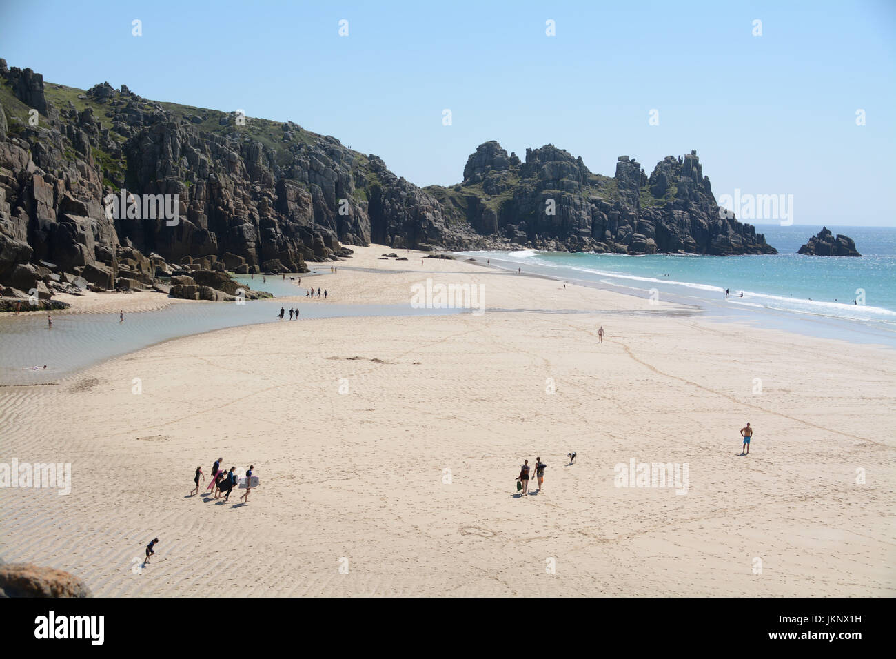 Treen, Cornwall, UK. 24th July 2017. UK Weather. With monday looking to be the best day of the week, tourists made their way down to the turquoise waters at Treen Beach, with many German holiday makers amongst them. Credit: cwallpix/Alamy Live News Stock Photo